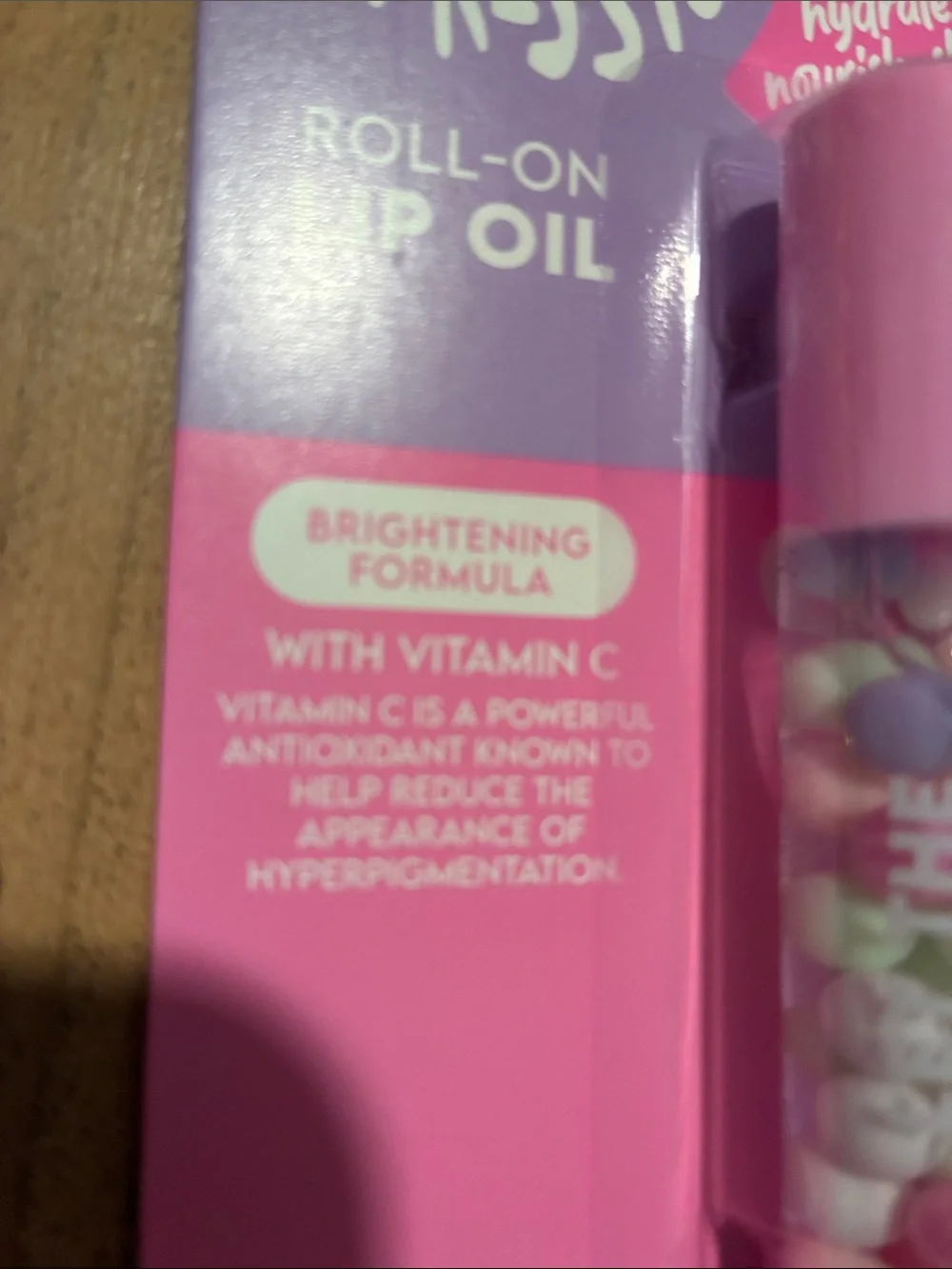 Impressions Roll-On Lip Oil Duo in Pink and Purple Packaging